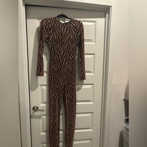 Gold and black back out body suit . Brand new